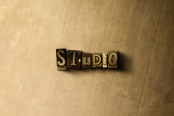 STUDIO - close-up of grungy vintage typeset word on metal backdrop. Royalty free stock illustration.  Can be used for online banner ads and direct mail.