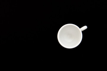 top view of a white cup, isolated on black background