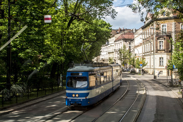 Krakow Poland old tram carriages transportation train downtown area historic buildings