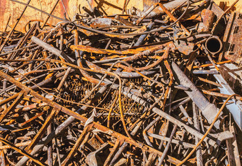 A pile of old rusty metal products