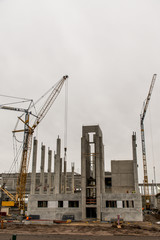 concrete construction yard building site crane cloudy sky background