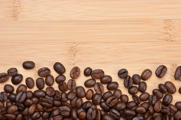 Coffee beans on a wooden background