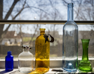 Five colored bottles