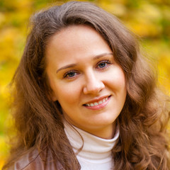 Fototapeta premium Young beautiful woman in autumn park