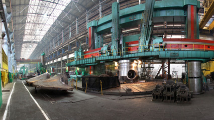 Fototapeta premium Manufacture of water turbines. The huge machine turbine production. Large parts of the plant.