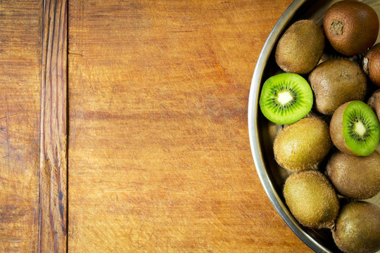 Juicy kiwi fruit on a tray with copy space