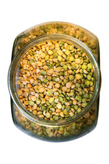 Foodstuff: mixture of dry peas in a glass container over white background