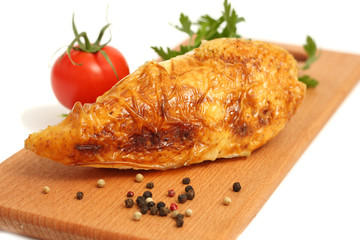 Grilled chicken on plate isolated on white