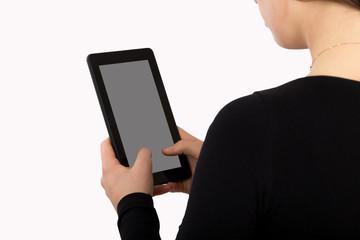 Young female using her tablet. Close up view. isolated on white background