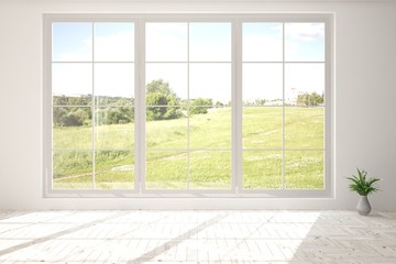 Obraz na płótnie Canvas White empty room with green landscape in window. Scandinavian interior design