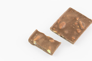 Stack of chocolate pieces on a white backgroun and isolated 