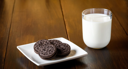 some chocolate cookies and a glass of milk