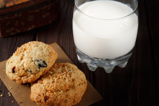 Homemade cookies with a cup of milk, close view.