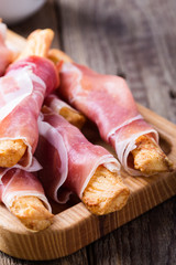 Puff pastry cheese sticks with cured ham