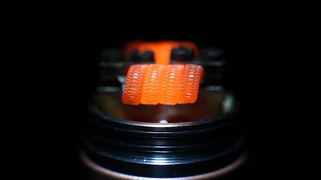 Burning staple staggered fused clapton coil in rebuildable dripping atomizer