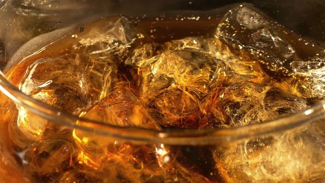 Two high quality videos of cold cola with bubbles in 4K