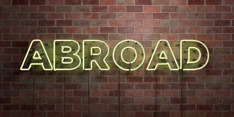 ABROAD - fluorescent Neon tube Sign on brickwork - Front view - 3D rendered royalty free stock picture. Can be used for online banner ads and direct mailers..