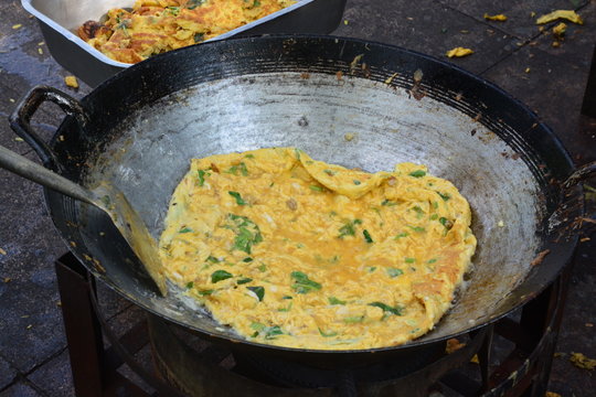 omelet is a dish made from beaten eggs quickly fried with butter or oil in a frying pan