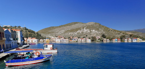 Fototapeta na wymiar Harbor-boats on central-houses on Pera Meria west side. Kastellorizo-Dodecanese-Greece. 1528