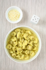Traditional Italian Tortellini in Brodo (broth) soup, photographed overhead with natural light