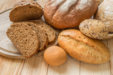 Fresh fragrant bread on the wooden table.