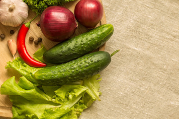 raw vegetables on a round wooden Board. top view. Space for text