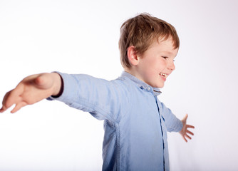 Child with arms open wide 