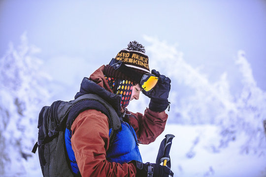 Side View Of Man Preparing For Skiing