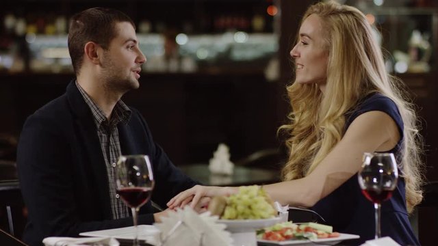 woman getting a present from boyfriend