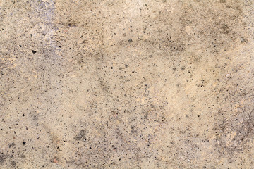 The surface of the old plaster beige wall