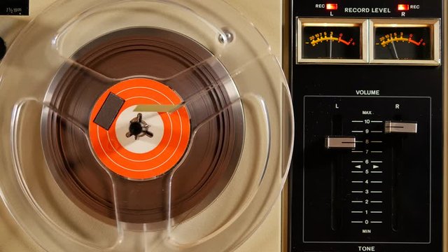 Analog vu meter of a vintage tape recorder machine while recording