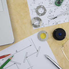 research and development process in physics and engineering. Components, records and tools on the...