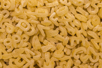 Frame full of alphabet noodles or alphabet pasta