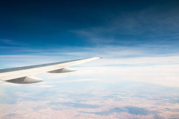 Wing of aeroplane flying in the sky