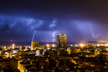 Naklejka na ściany i meble Lightning and thunder during a thunderstorm, one night in Alicante