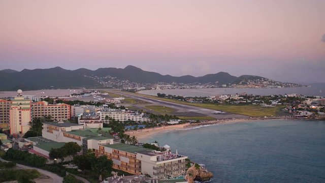 St Maartin Aerial v7 Flying low backwards with airport and runway views.