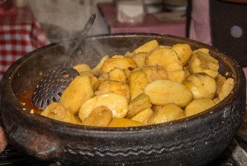 Scalloped potatoes in earthenware dish