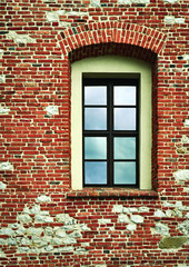 high window in a brick wall