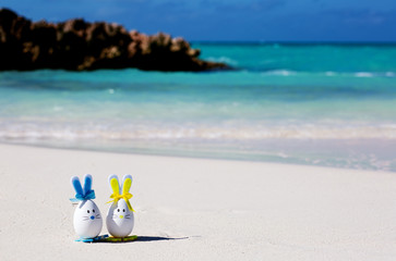 Easter, estereggs on the beach, sand, ocean, sea