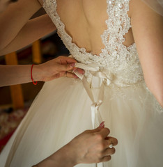 The process of dressing a wedding dress
