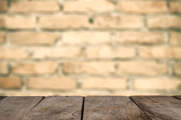 Wood table top on brick wall texture background, for product mock up