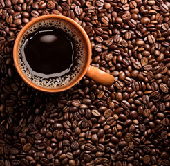 coffee cup on coffee beans background