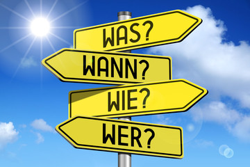 Signpost with four arrows - Was? Wann? Wer? Wie? (German) / What? When? Who? How? (English).