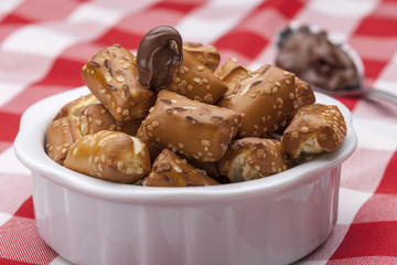 Pretzels and chocolate frosting.