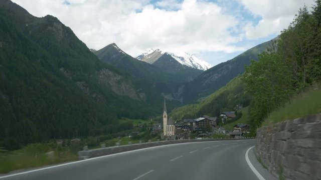 POV driving to Heiligenblut am Grossglockner in Carinthia, Austria, with Grossglockner in the background.