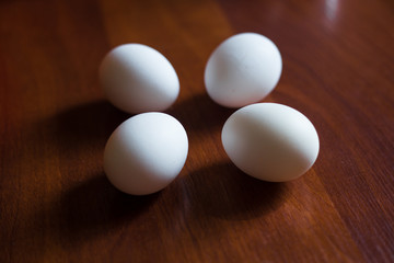 Eggs on wooden table background