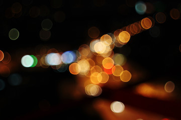 Night city lights bokeh background. Defocused bokeh lights. Blurred bokeh. Bokeh light vintage background. Abstract colorful.