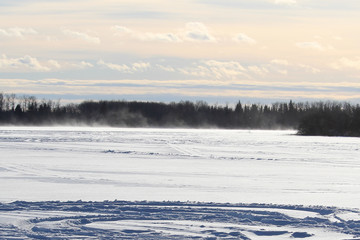 Blowing and Drifting Snow Across an Open Lake