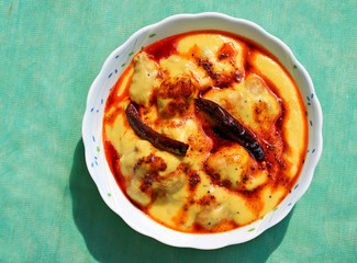 Kadhi Pakoad; Kadhi, an Indian comfort food of dumplings in yogurt sauce. Indian cuisine, Indian style food.