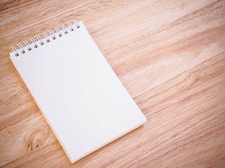 Notepad on the wooden desk table